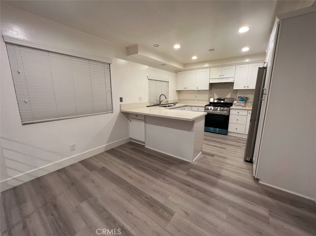 6939 Tahiti Drive Cypress, CA 90630 - Photo 2 of 15 a view of kitchen with sink and refrigerator