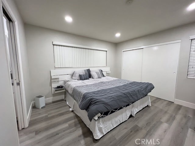 6939 Tahiti Drive Cypress, CA 90630 - Photo 9 of 15 a bedroom with a bed and a window