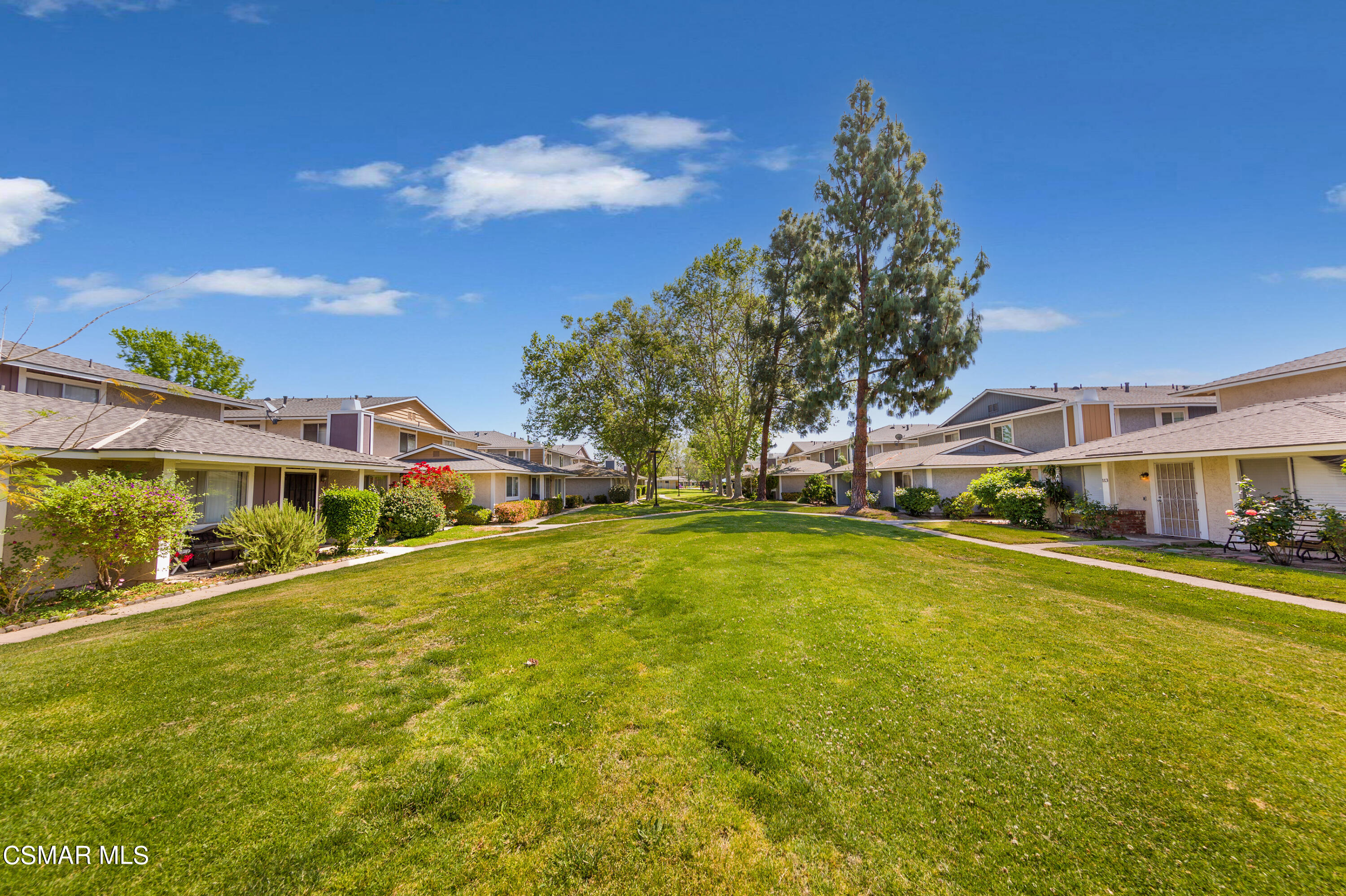 511 Spring Road, Unit 8 Moorpark, CA 93021 - Photo 15 of 17 a front view of a house with a big yard