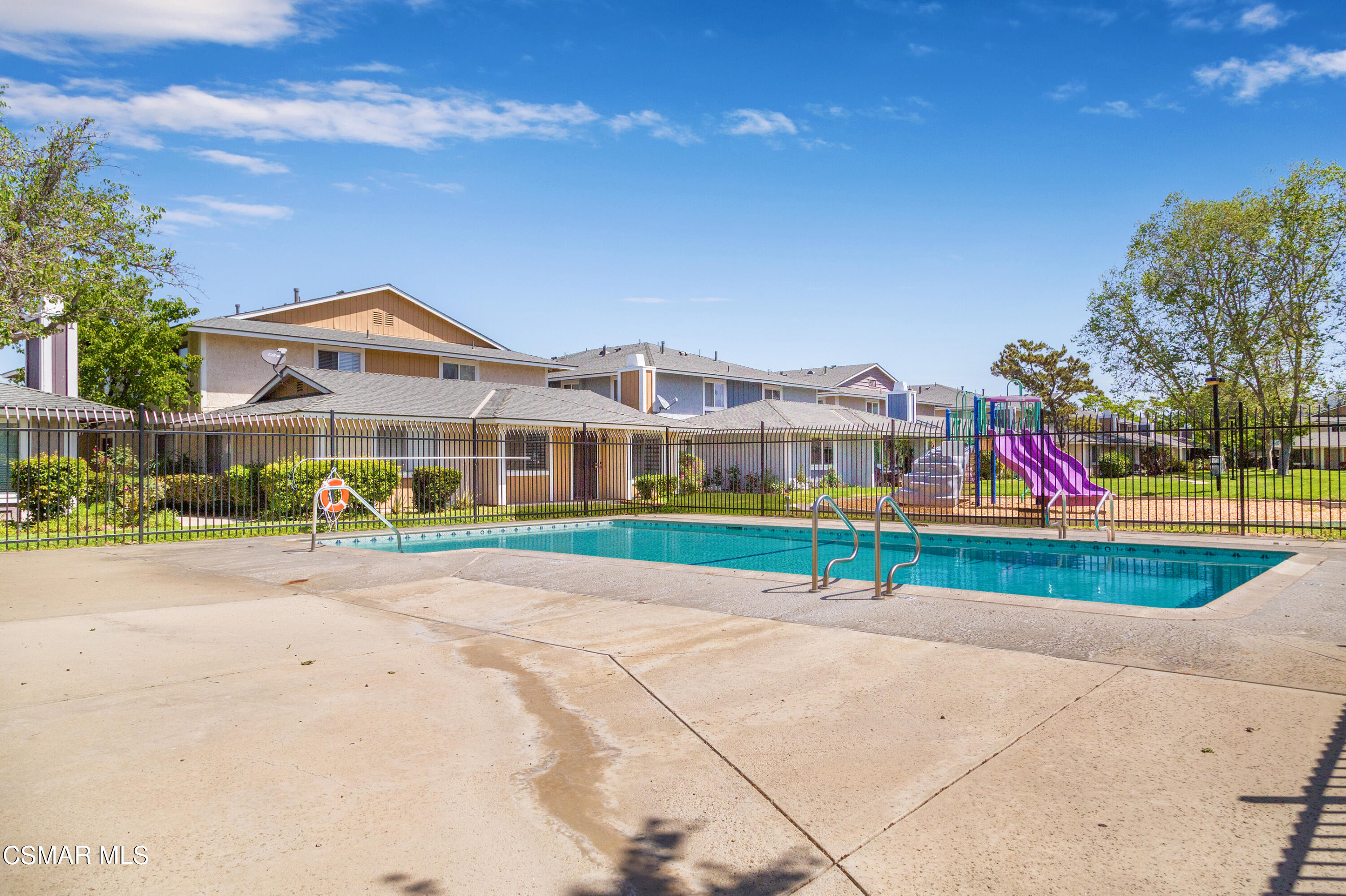 511 Spring Road, Unit 8 Moorpark, CA 93021 - Photo 17 of 17 a view of multiple houses with a yard and potted plants