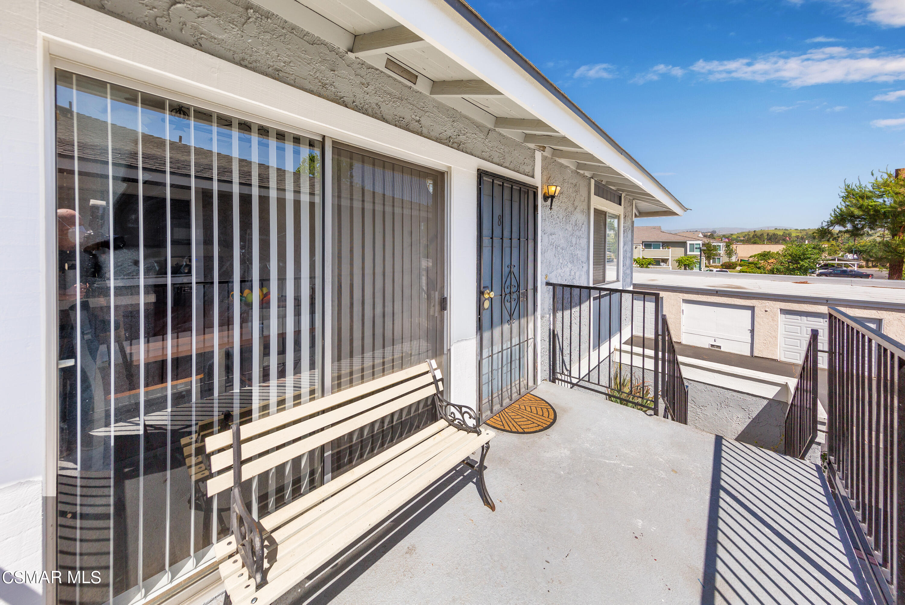 511 Spring Road, Unit 8 Moorpark, CA 93021 - Photo 3 of 17 a view of a patio with a table and chairs