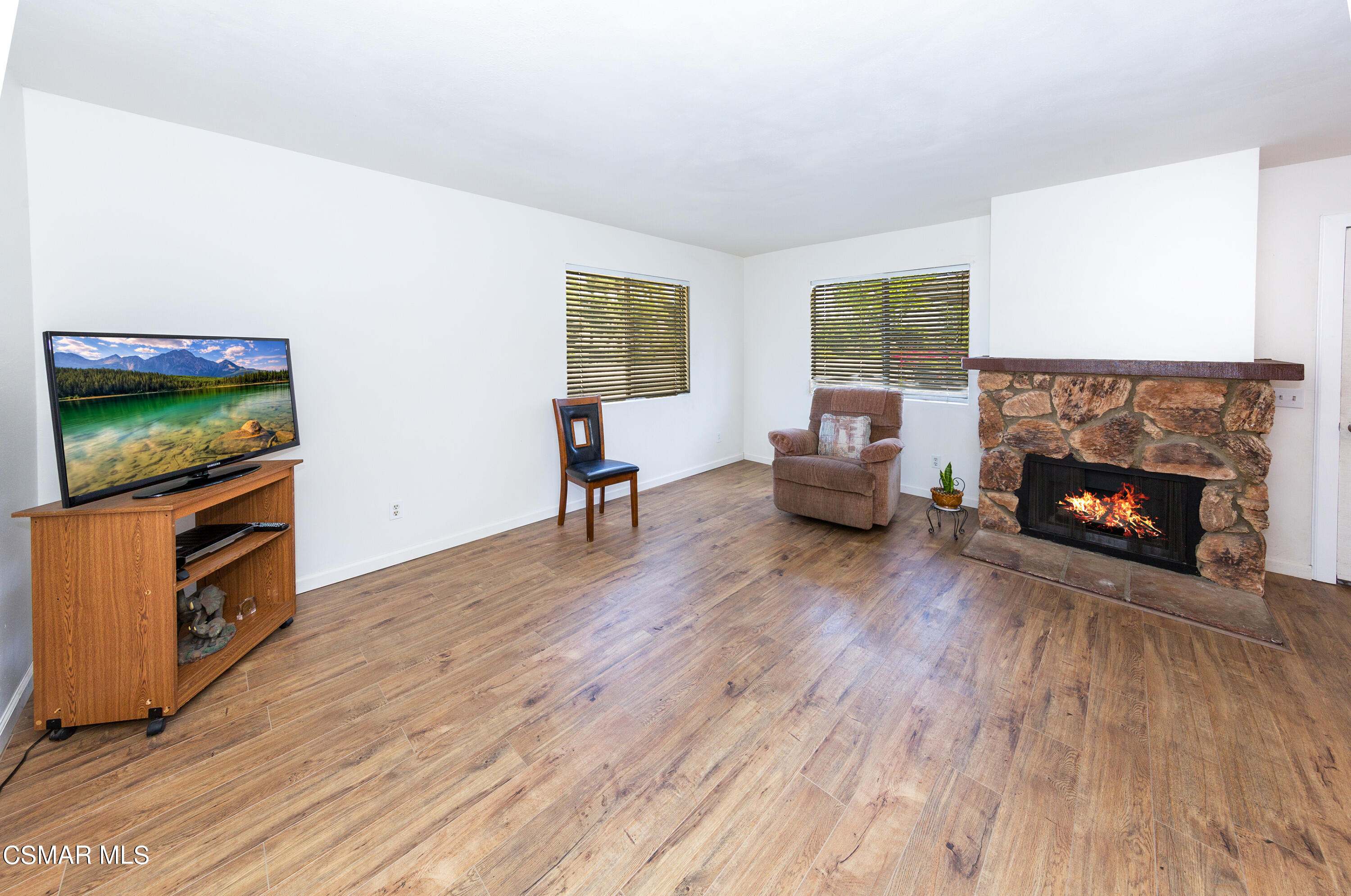 511 Spring Road, Unit 8 Moorpark, CA 93021 - Photo 4 of 17 a living room with furniture and a fireplace