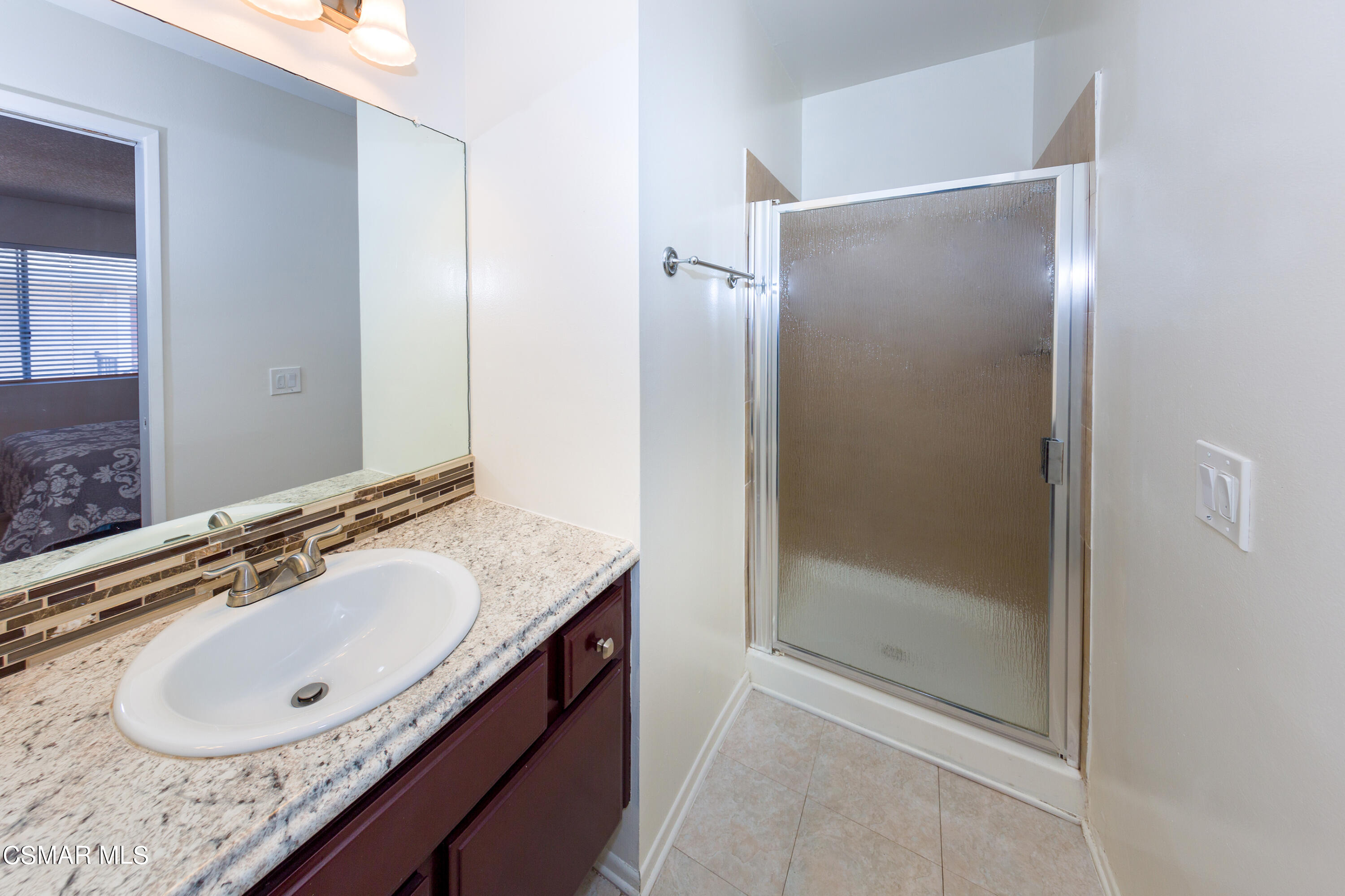 511 Spring Road, Unit 8 Moorpark, CA 93021 - Photo 10 of 17 a bathroom with a sink vanity granite tub and shower