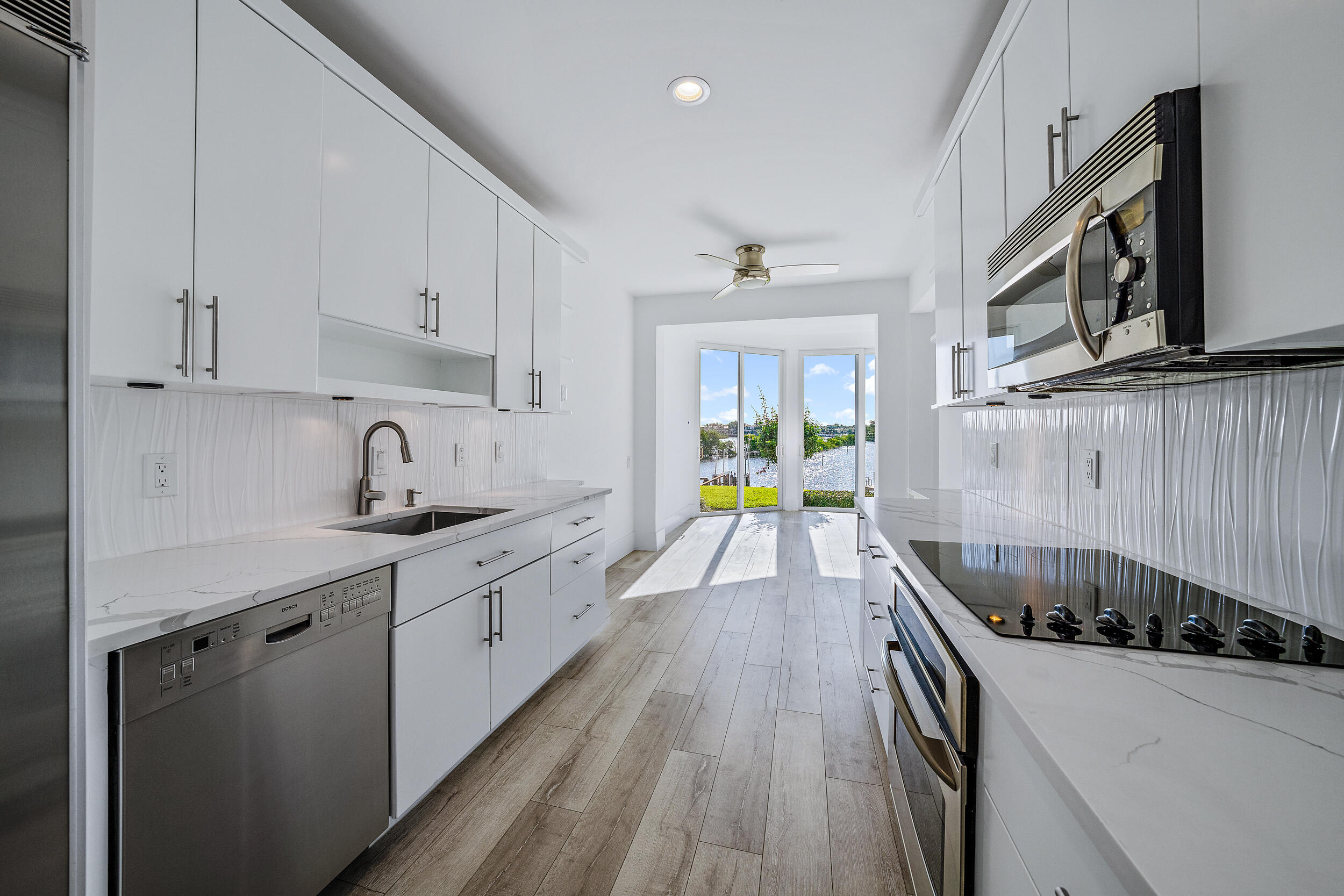 226 Eagle Drive Jupiter, FL 33477 - Photo 12 of 31 a kitchen with a sink a stove and cabinets