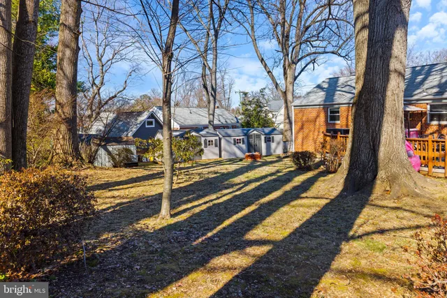 a view of a backyard with chairs