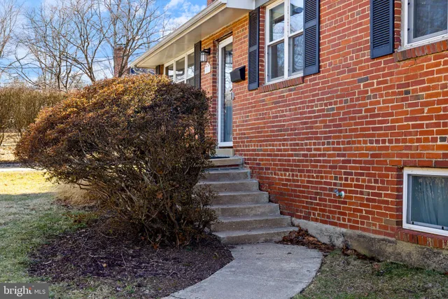 a view of a brick house with windows