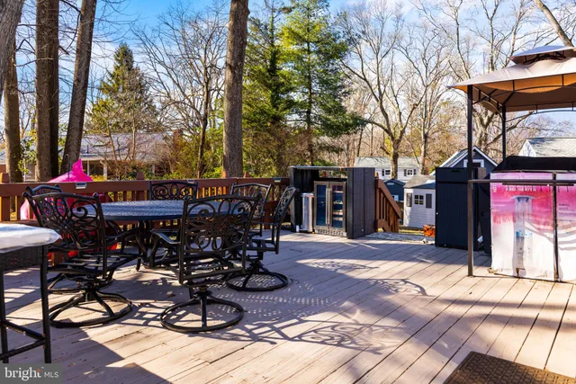 a wooden bench sitting in front of a house
