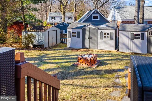 a view of a house with wooden fence