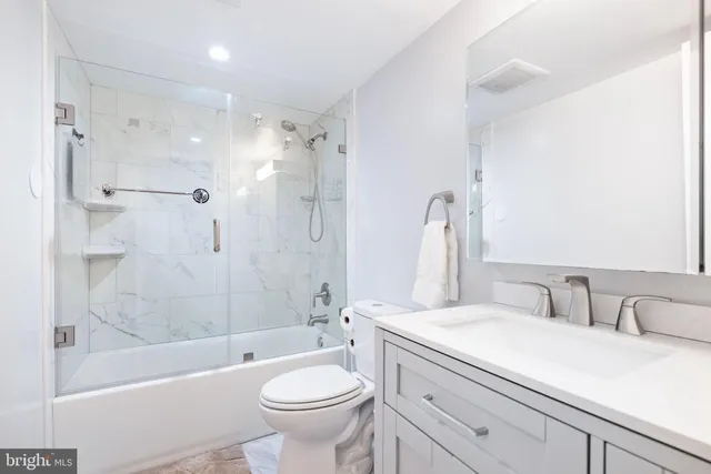 a bathroom with a sink a toilet and a bathtub