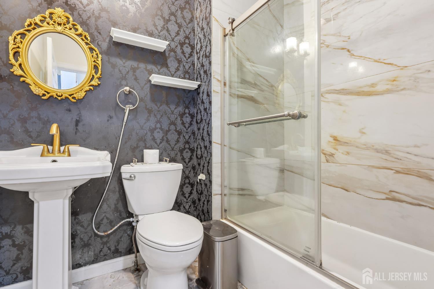 489 Plainfield Road Edison, NJ 08820 - Photo 11 of 39 a bathroom with a toilet sink and a shower