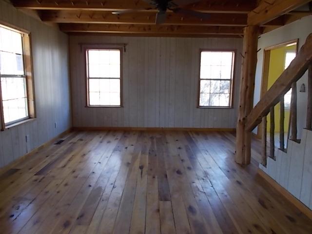 8119 Primm Springs Road Lyles, TN 37098 - Photo 2 of 12 an empty room with wooden floor and windows