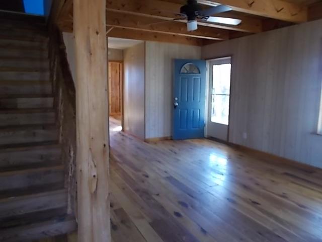 8119 Primm Springs Road Lyles, TN 37098 - Photo 3 of 12 wooden floor in an empty room with a window