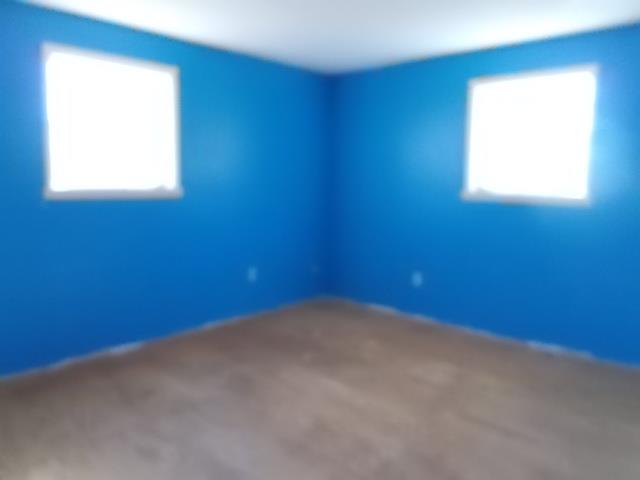 8119 Primm Springs Road Lyles, TN 37098 - Photo 9 of 12 an empty room with a window