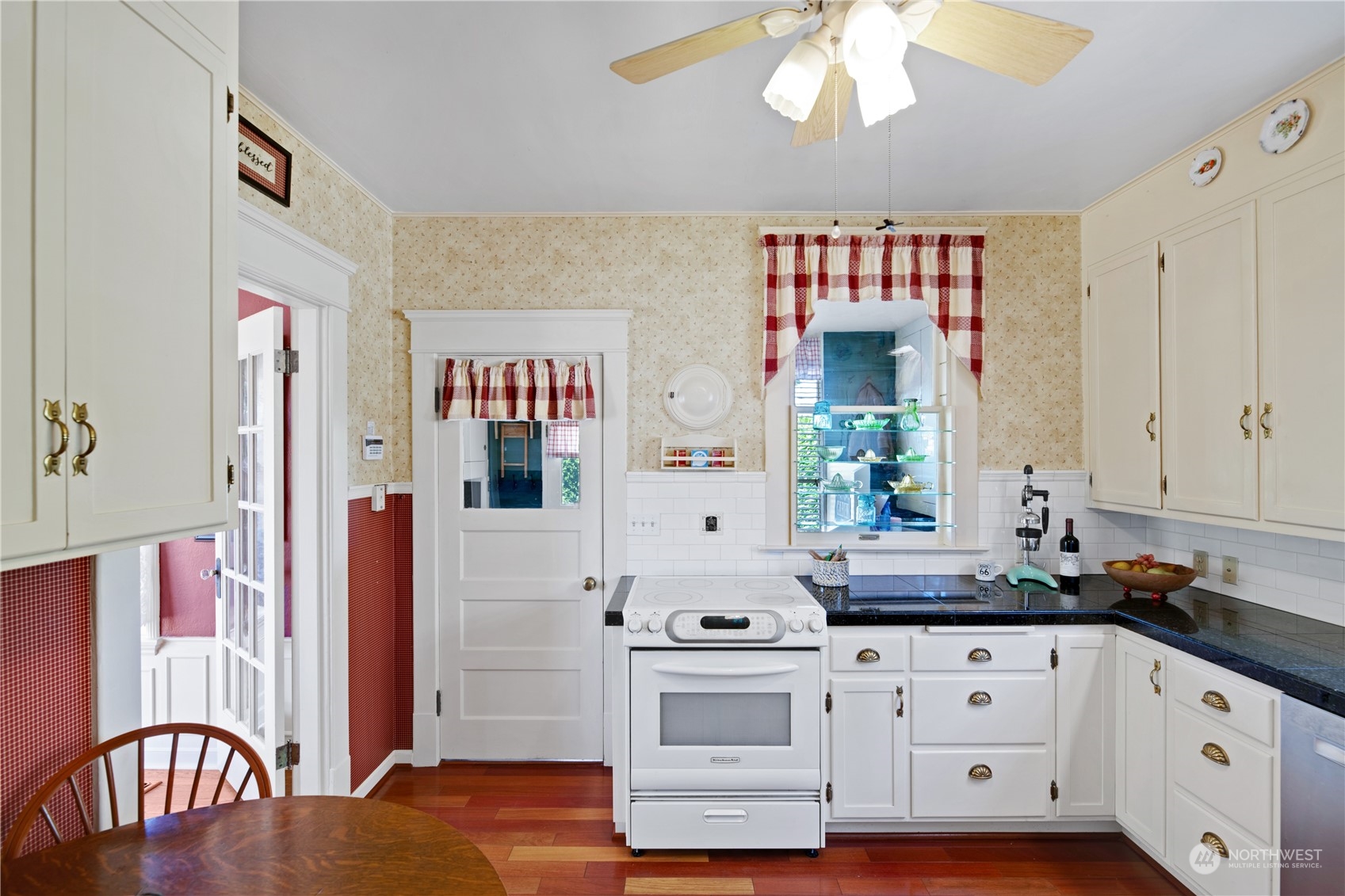 1812 Rucker Avenue Everett, WA 98201 - Photo 11 of 36 a open kitchen with stainless steel appliances granite countertop a stove a sink and a refrigerator