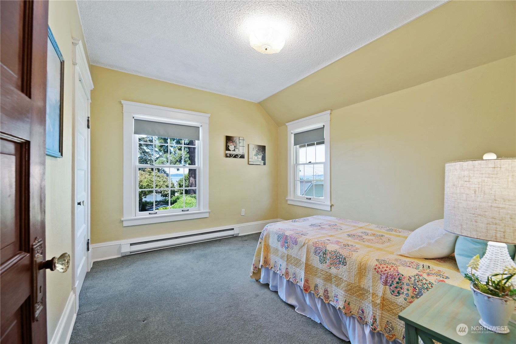 1812 Rucker Avenue Everett, WA 98201 - Photo 22 of 36 a bedroom with a bed and window
