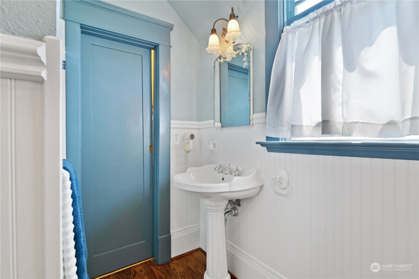 1812 Rucker Avenue Everett, WA 98201 - Photo 24 of 36 a bathroom with a sink a mirror and a window