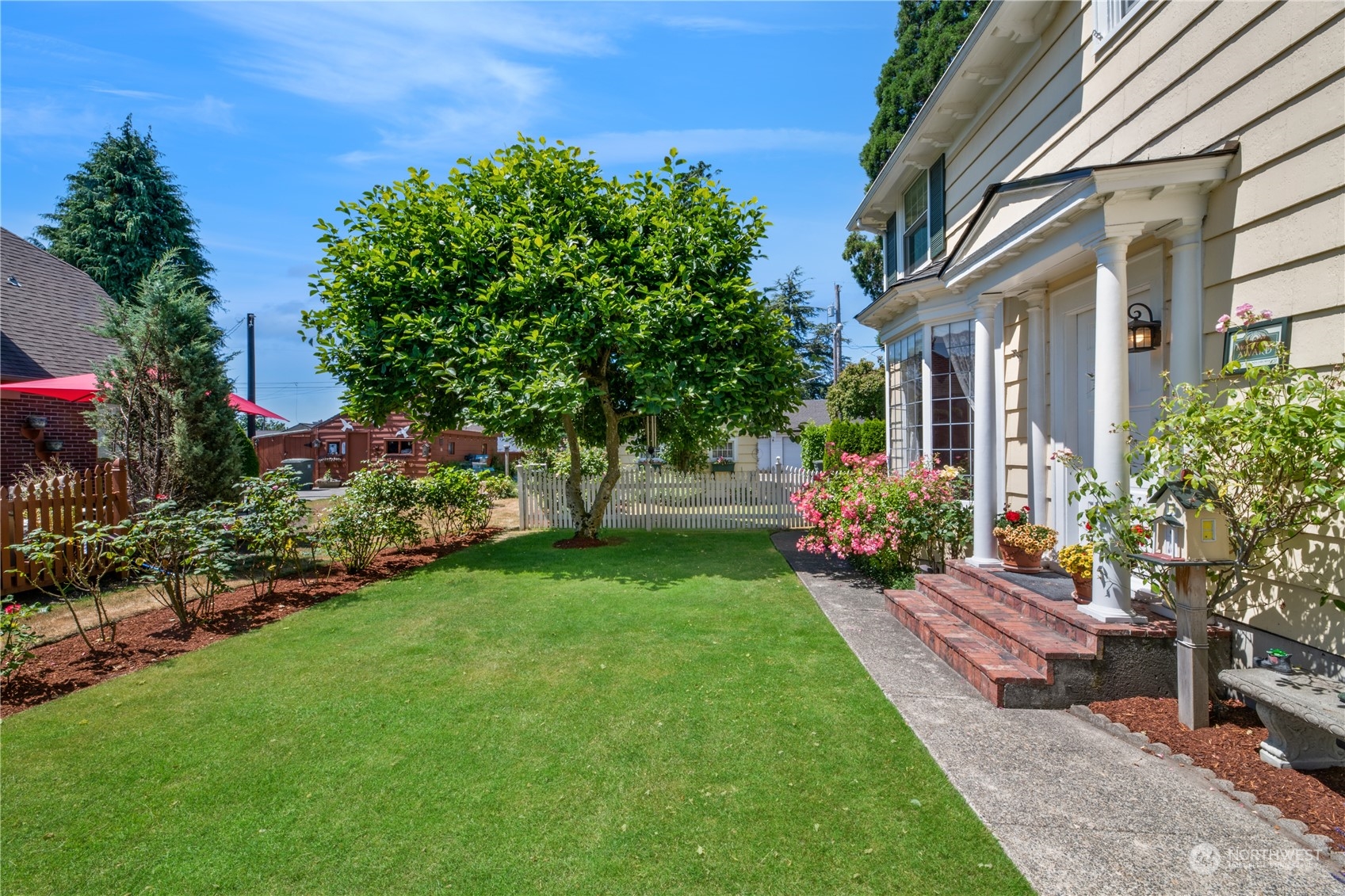 1812 Rucker Avenue Everett, WA 98201 - Photo 3 of 36 a view of a house with a backyard and garden