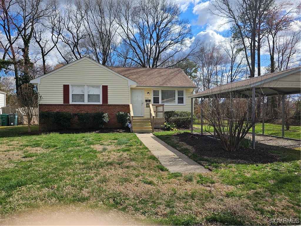 3109 Putney Road Henrico, VA 23228 - Photo 1 of 27 a front view of a house with garden