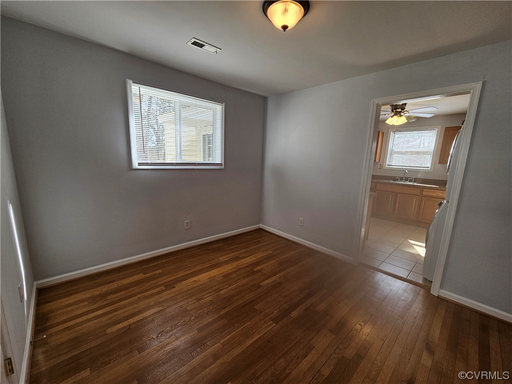 3109 Putney Road Henrico, VA 23228 - Photo 12 of 27 a view of an empty room with wooden floor and a window