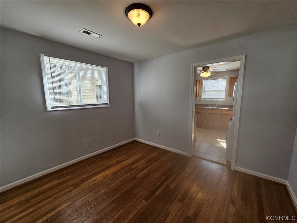 3109 Putney Road Henrico, VA 23228 - Photo 14 of 27 a view of an empty room with wooden floor and a window