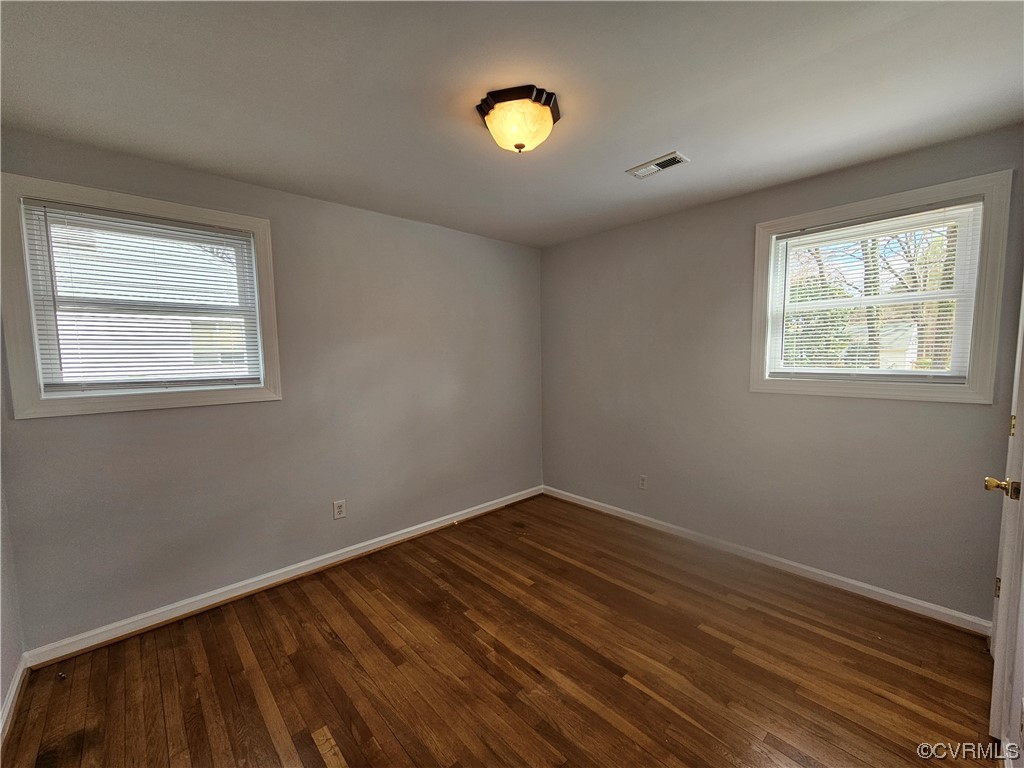 3109 Putney Road Henrico, VA 23228 - Photo 19 of 27 a view of an empty room with wooden floor and a window