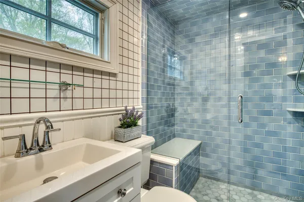 a bathroom with a sink and mirror