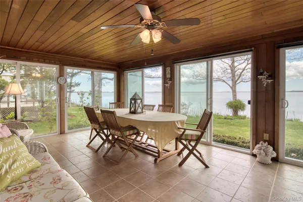 a view of a dining room with furniture window and outside view
