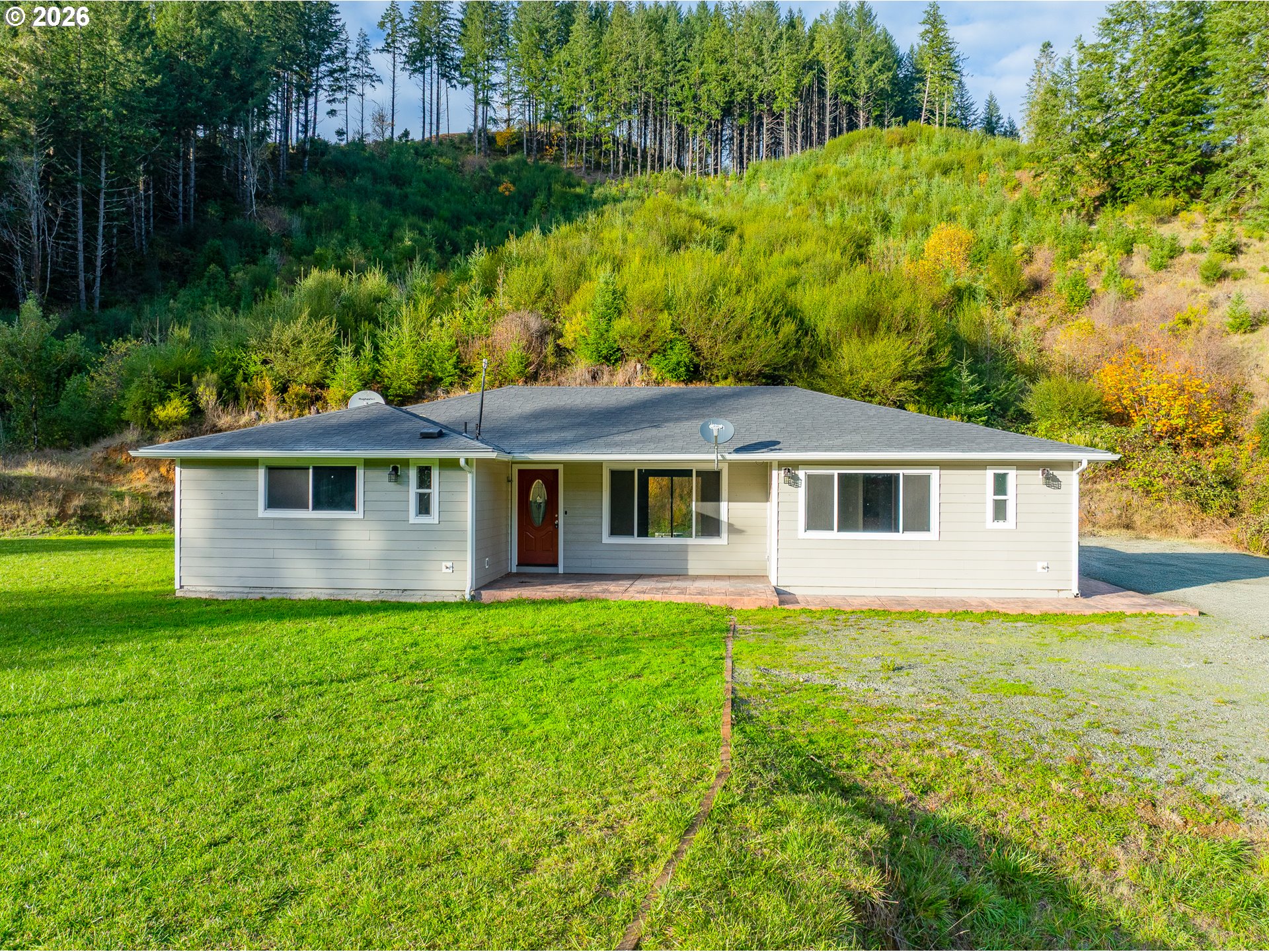 16855 Highway 42 Myrtle Point, OR 97458 - Photo 1 of 43 a front view of a house with yard and green space