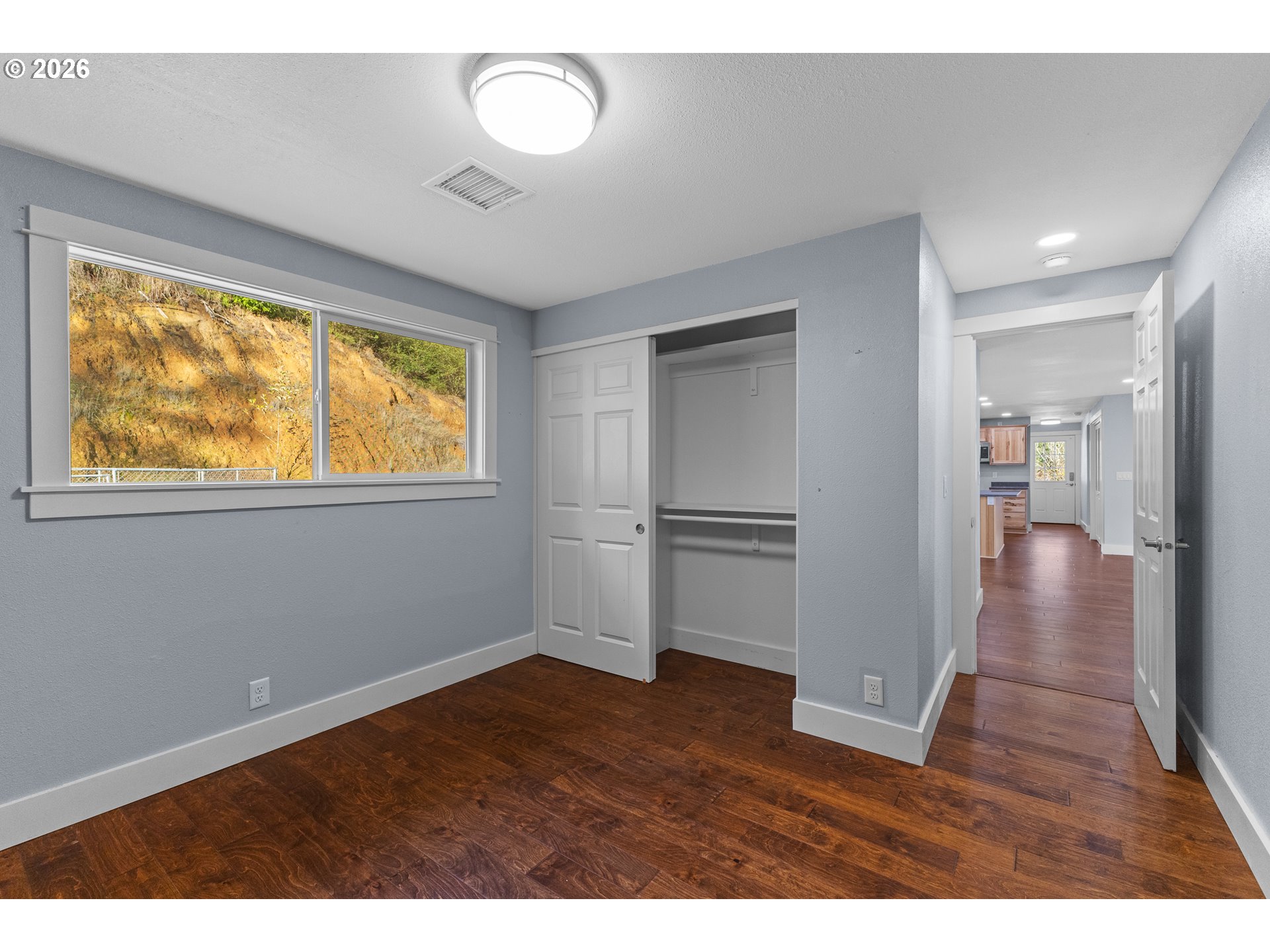 16855 Highway 42 Myrtle Point, OR 97458 - Photo 15 of 43 a view of empty room with wooden floor and fan