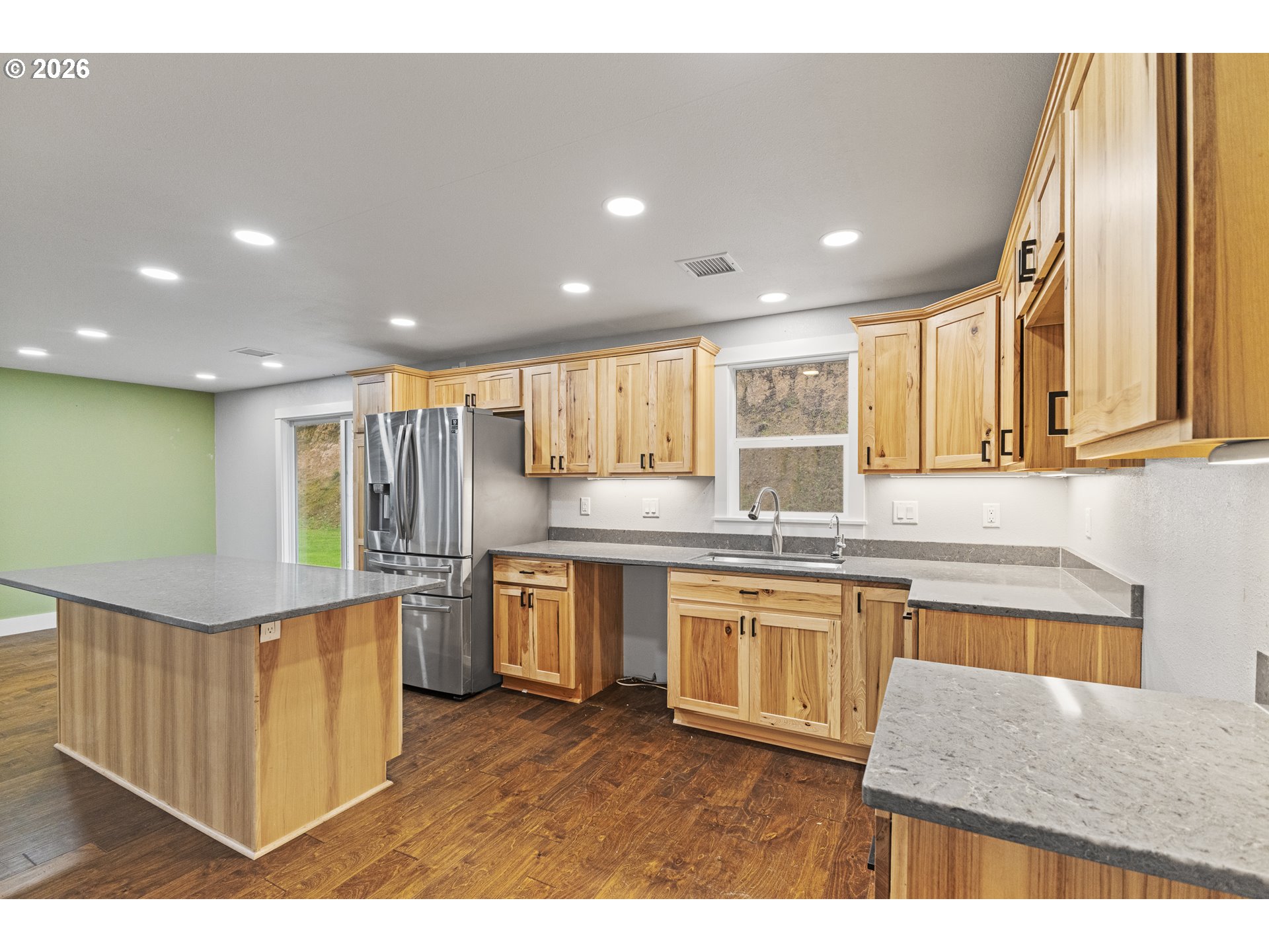 16855 Highway 42 Myrtle Point, OR 97458 - Photo 20 of 43 a kitchen with stainless steel appliances granite countertop a stove a sink and a microwave