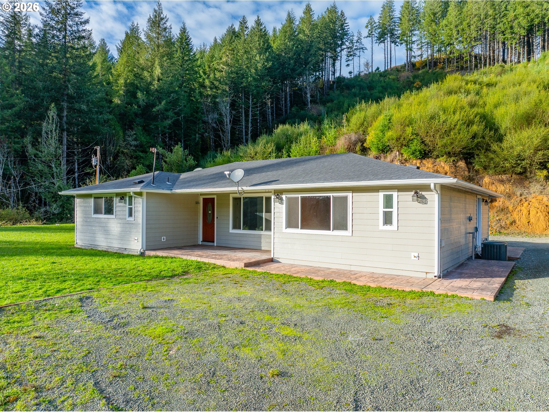 16855 Highway 42 Myrtle Point, OR 97458 - Photo 2 of 43 a view of a house with a yard and sitting area