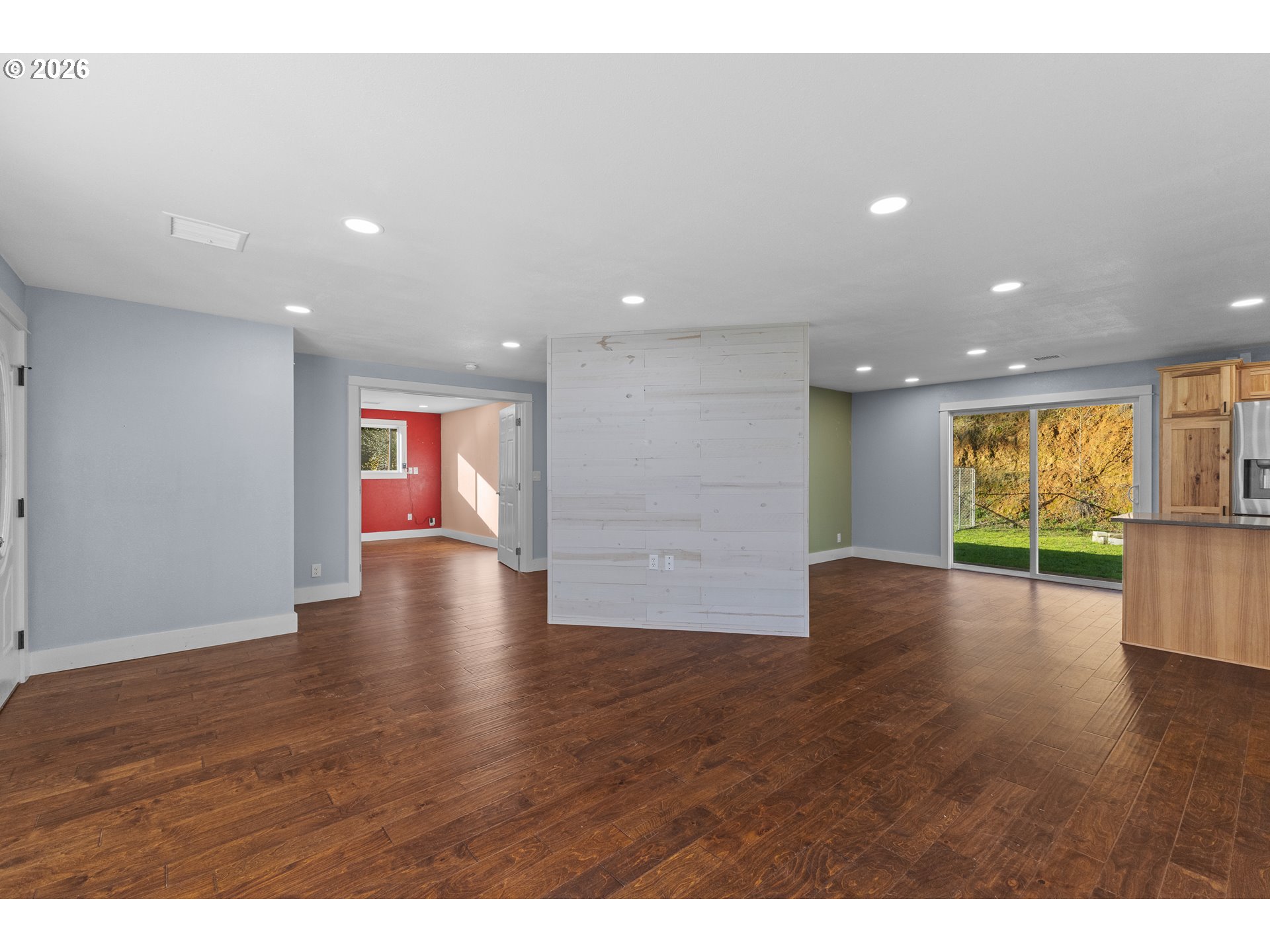 16855 Highway 42 Myrtle Point, OR 97458 - Photo 5 of 43 a view of an empty room with wooden floor and a window