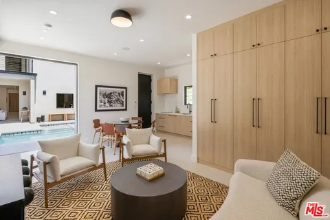 a living room with furniture and a rug