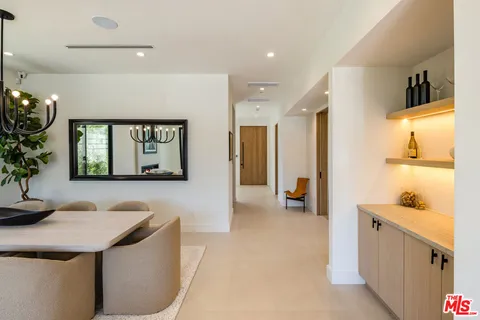 a living room with furniture and flowers