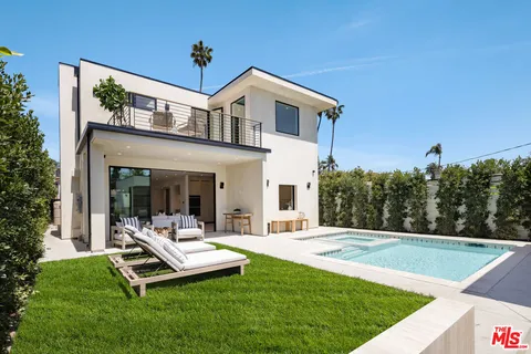 a view of a patio with a table and chairs