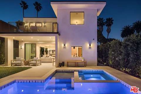 swimming pool view with a outdoor seating space