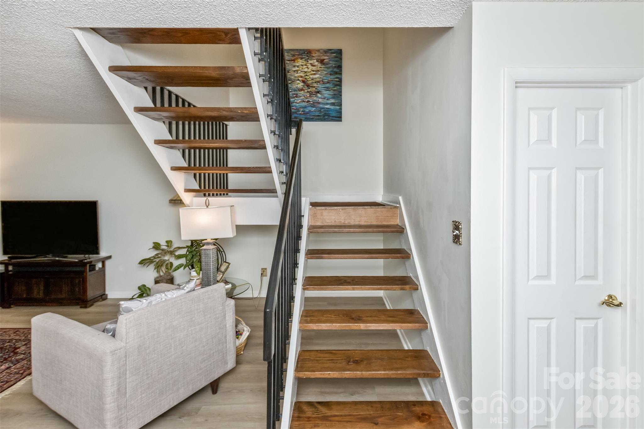 503 Crowfields Lane Asheville, NC 28803 - Photo 13 of 41 a view of a livingroom with furniture and stairs