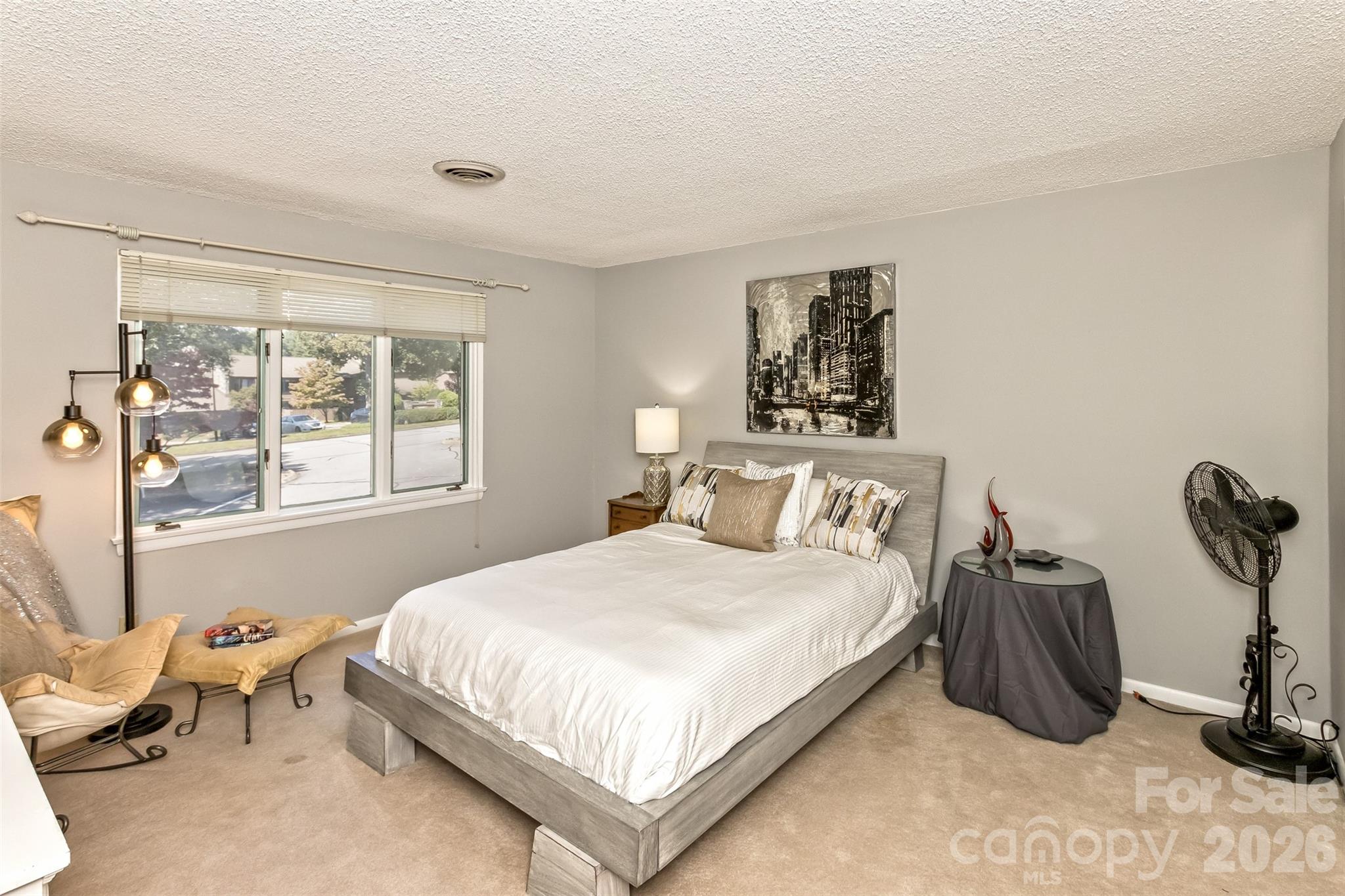 503 Crowfields Lane Asheville, NC 28803 - Photo 22 of 41 a bedroom with a bed and a window