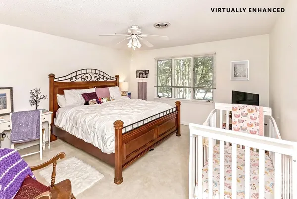 a bed room with a bed and a large window