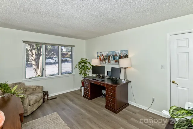 a workspace with furniture and window