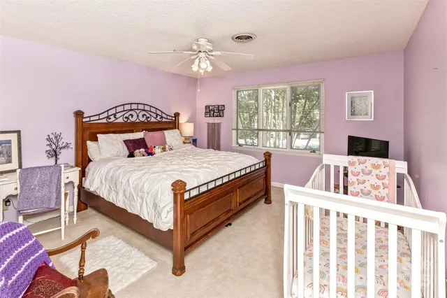 a bed room with a bed and a window