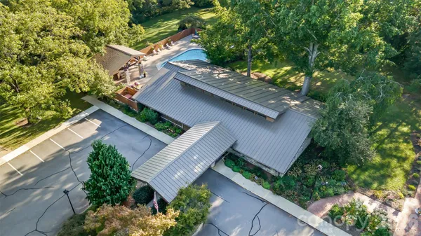 a view of a car park in front of a house