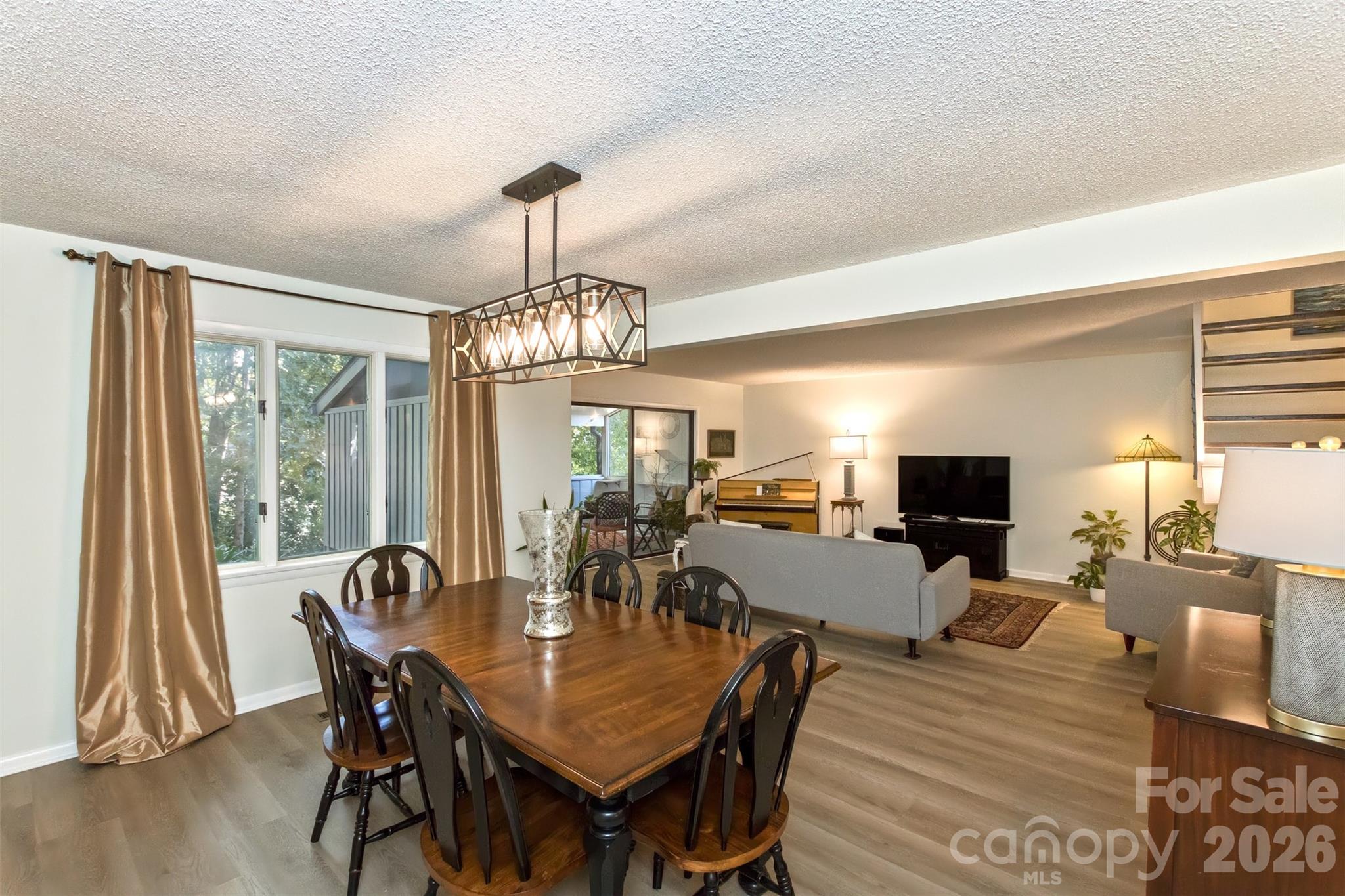 503 Crowfields Lane Asheville, NC 28803 - Photo 4 of 41 a view of a dining room with furniture window and wooden floor