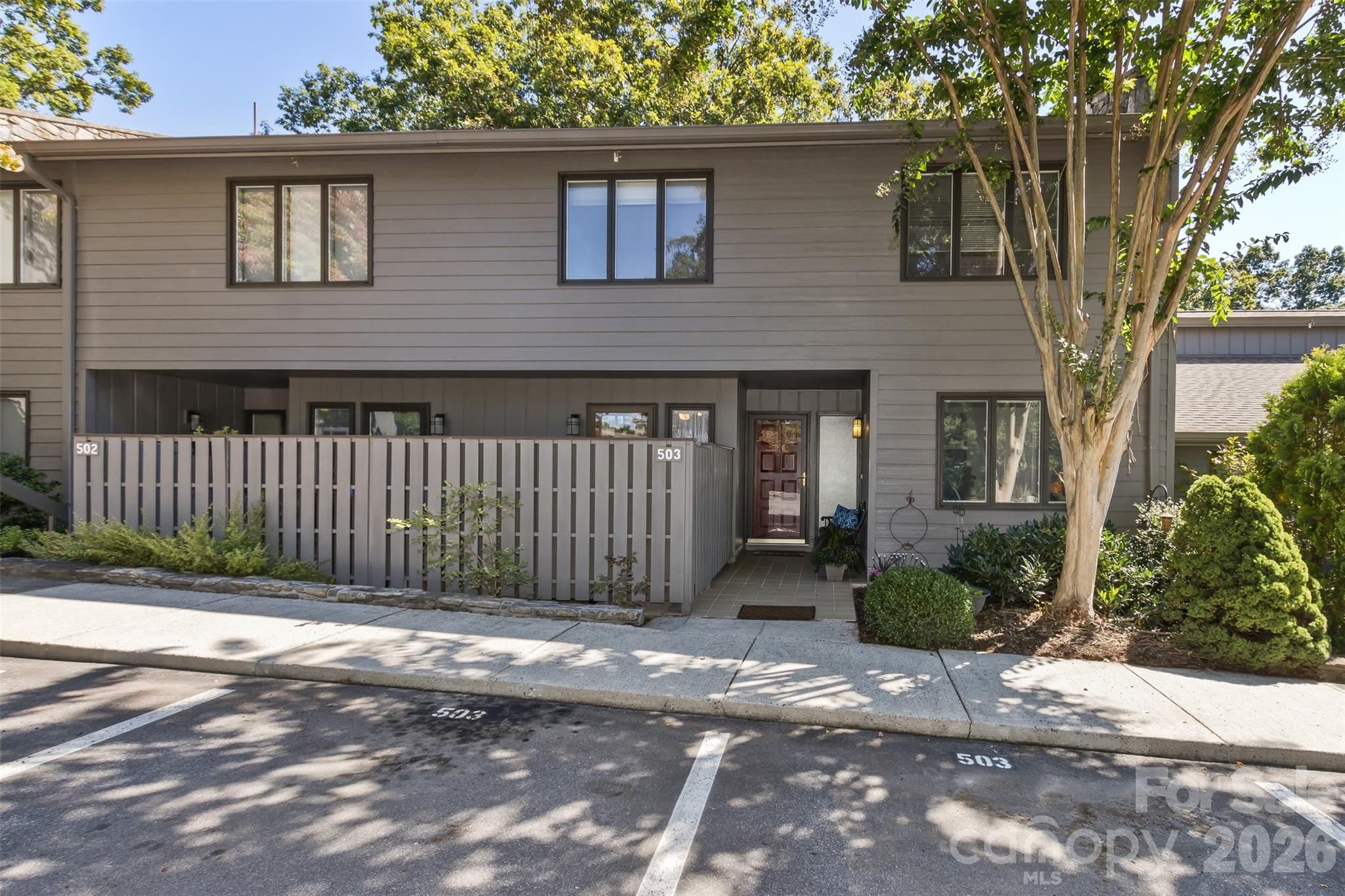 503 Crowfields Lane Asheville, NC 28803 - Photo 6 of 41 a front view of a house with a garden