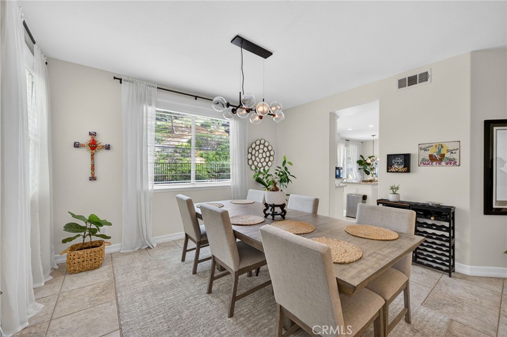 45136 Willowick Street Temecula, CA 92592 - Photo 11 of 75 a view of a dining room with furniture window and outside view