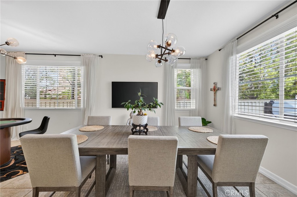 45136 Willowick Street Temecula, CA 92592 - Photo 14 of 75 a view of a dining room with furniture window and outside view