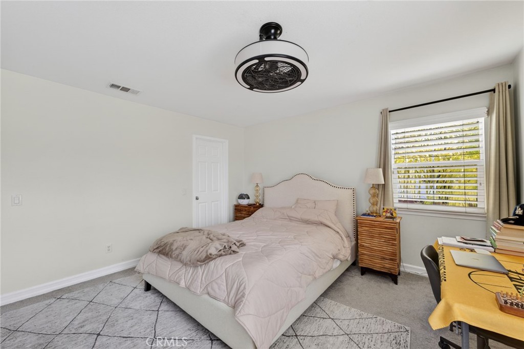 45136 Willowick Street Temecula, CA 92592 - Photo 28 of 75 a bedroom with a bed and a window