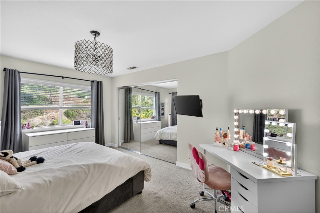 45136 Willowick Street Temecula, CA 92592 - Photo 33 of 75 a bedroom with a bed and a large window