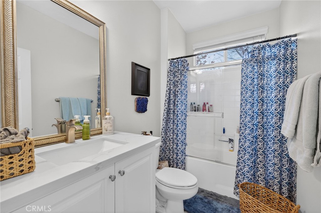45136 Willowick Street Temecula, CA 92592 - Photo 38 of 75 a bathroom with a sink toilet and shower