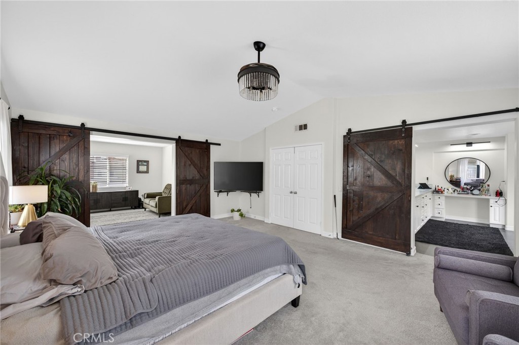 45136 Willowick Street Temecula, CA 92592 - Photo 43 of 75 a bedroom with a bed and wooden floor